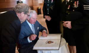 Prince Charles signs the Police Roll of Honour